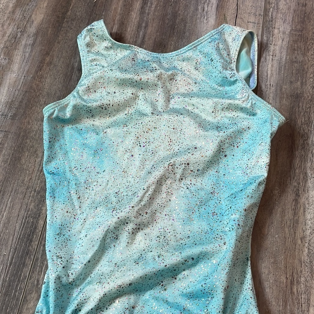 GK blue cloud leotard with metallic dots and open back detail
